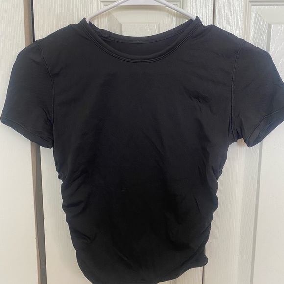 lululemon athletica Tops - Lululemon black tight shirt with detail on side!! Size 4 & in perfect condition!